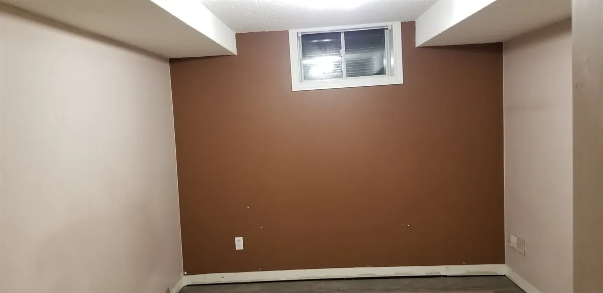 Basement rooms and painted stairs — Earlier room view