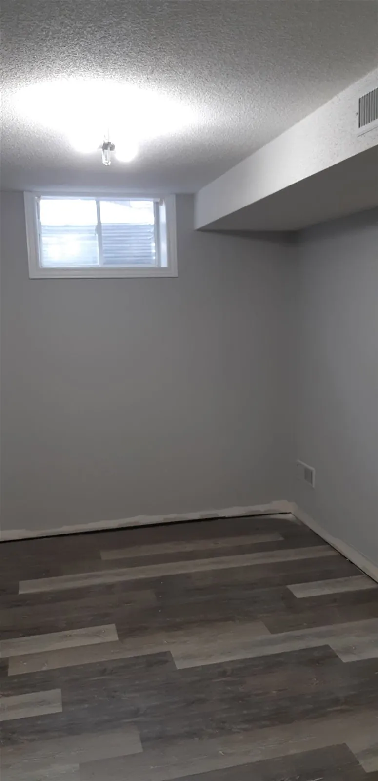 Basement rooms and painted stairs