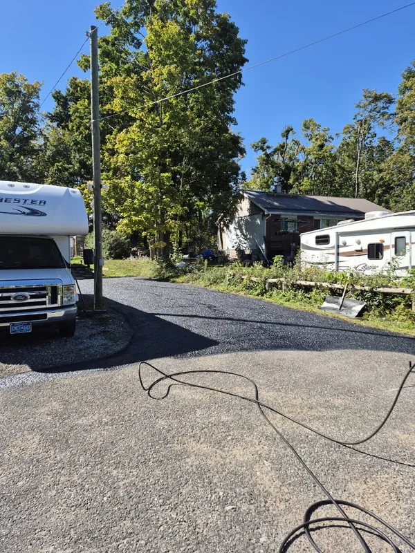 Equipment and surface preparation during genuine ProSeal driveway work in progress