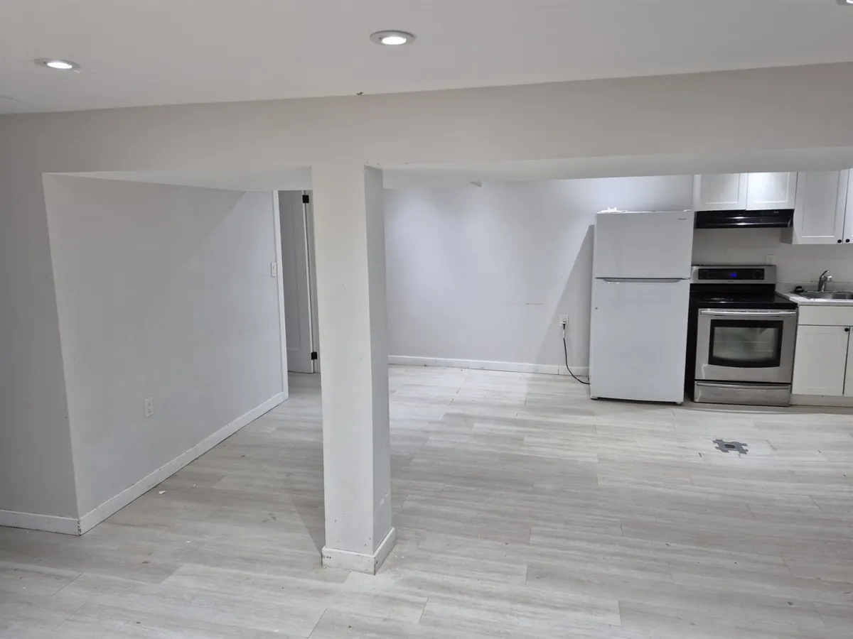 A light, open lower level — Kitchen and living area