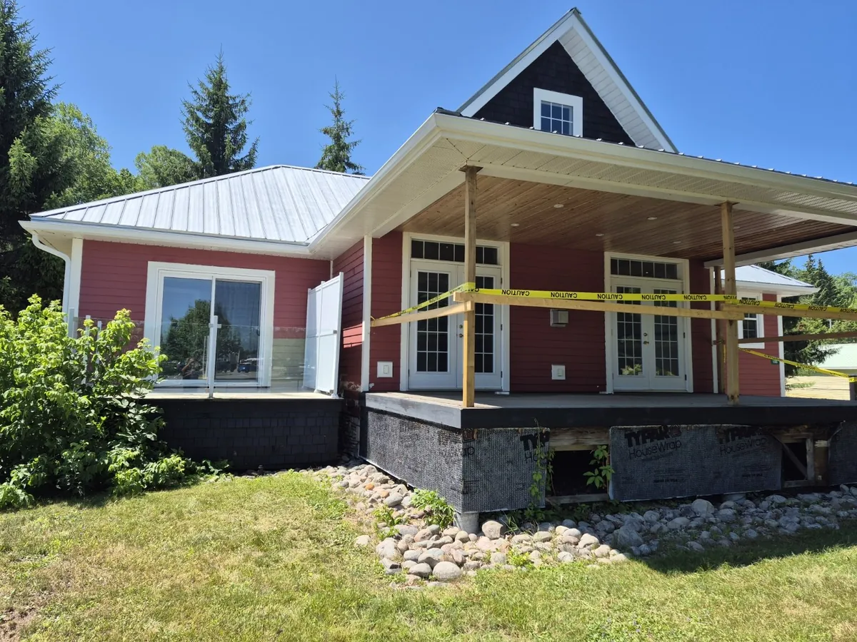 Red siding to a fresh white exterior — Before
